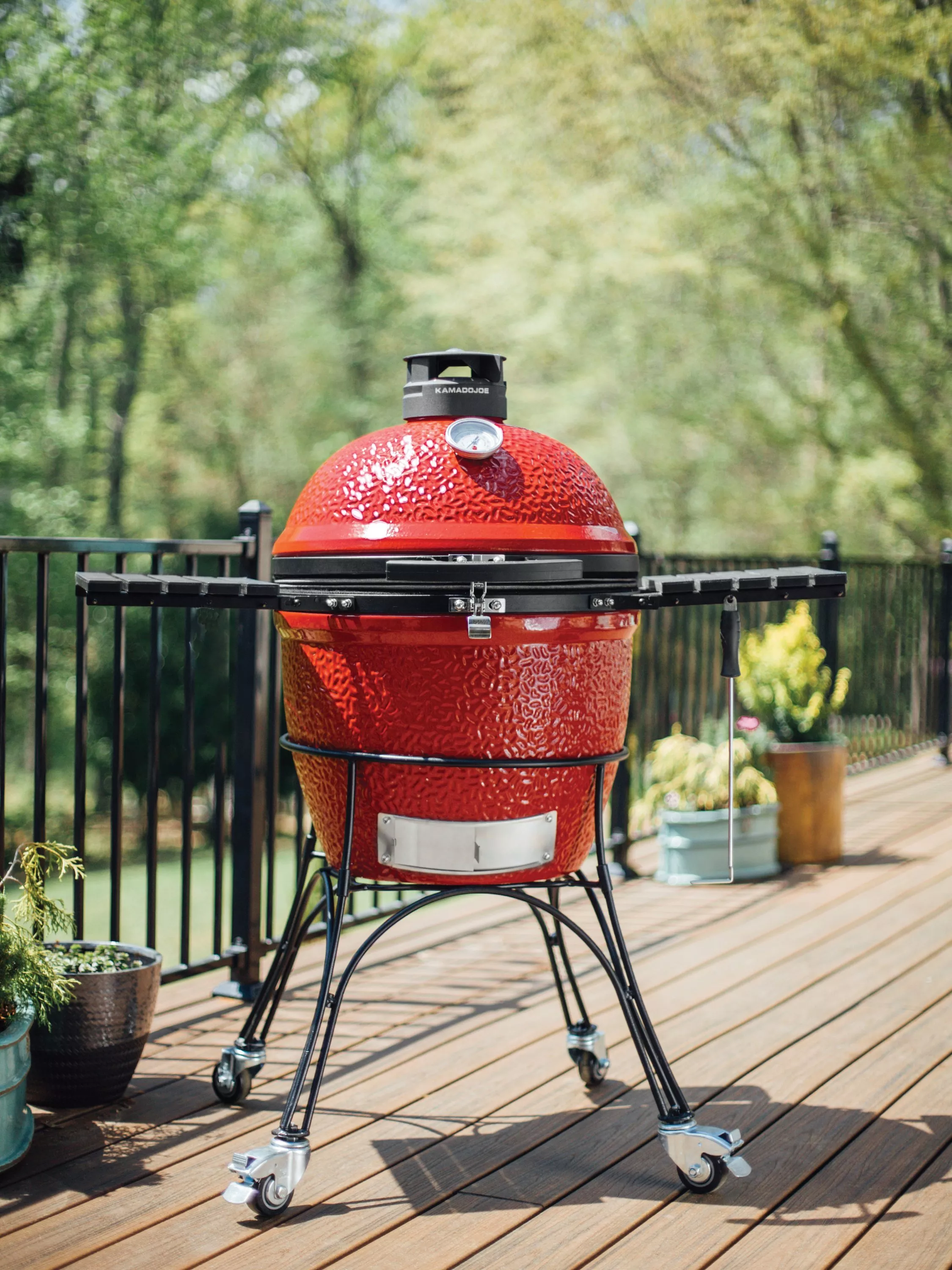 Kamado Joe Classic II charcoal grill in a garden setting